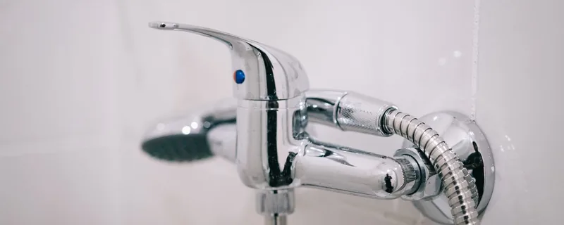 Chrome shower controls in a clean bathroom